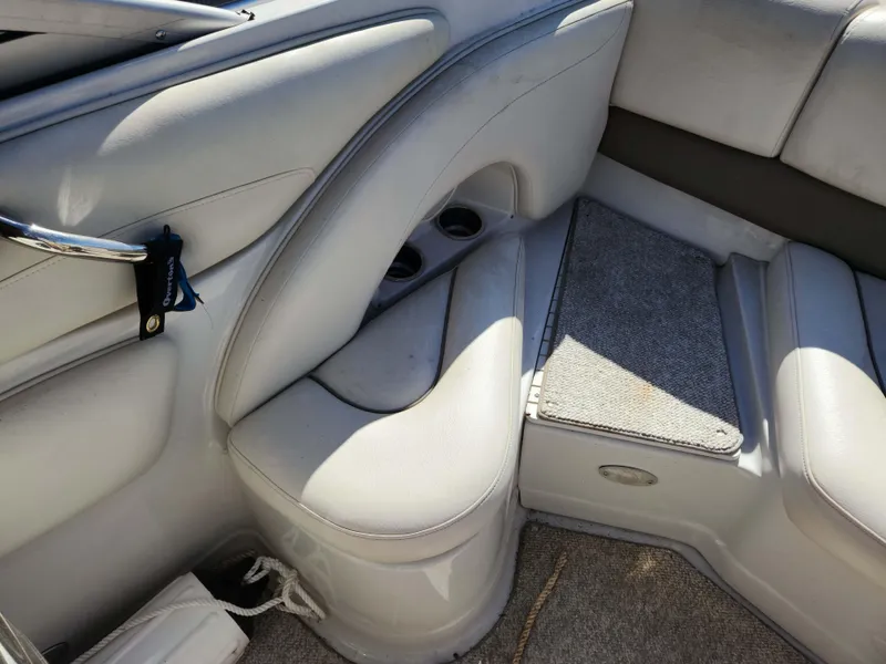 Slide: The Image of Interior seating of a 2006 Crownline 230 LS boat with light gray upholstery. - 9