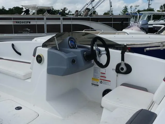 Slide: The Image of 2021 Tahoe T16 boat interior with steering wheel and dashboard controls. - 11
