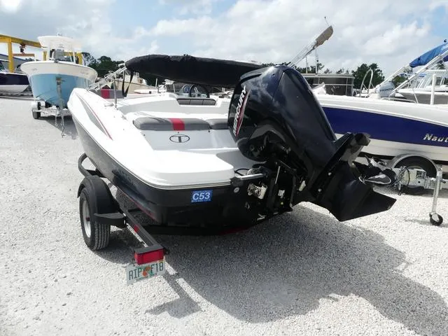 Slide: The Image of 2021 Tahoe T16 boat with Mercury outboard motor on a trailer in a marina. - 3