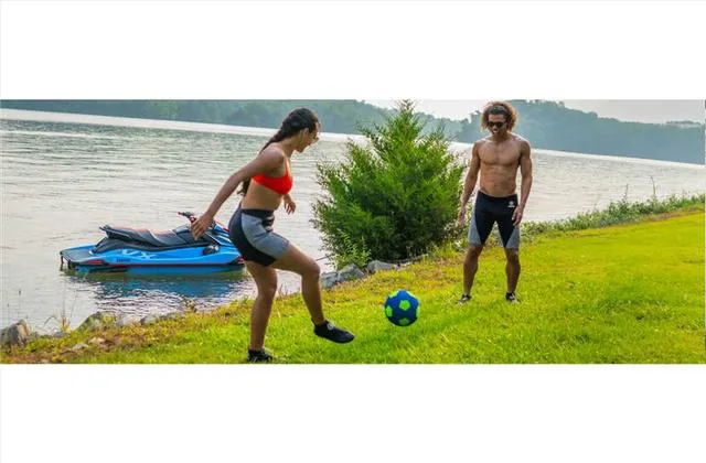 Slide: The Image of 2024 Yamaha WaveRunner VX jet ski in action on the water. - 11