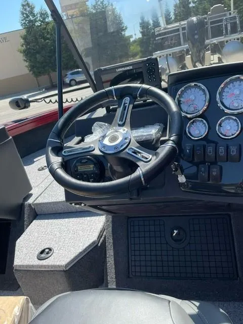 Slide: The Image of 2024 Tracker Targa V-19 WT boat interior with seating and dashboard view. - 3