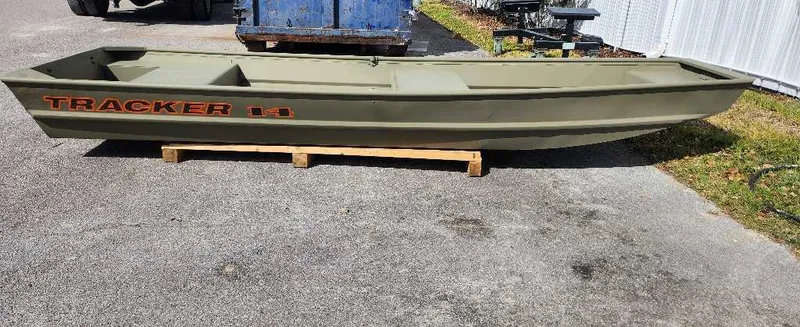 The Image of 2024 Tracker Grizzly 1436 Jon boat on a wooden stand. - 0