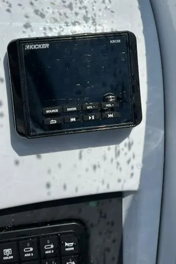 Slide: The Image of Kicker audio system on 2024 Tahoe 210 S boat dashboard. - 11