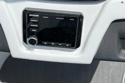 Slide: The Image of Kicker media receiver on 2024 Tahoe 210 S boat dashboard. - 9