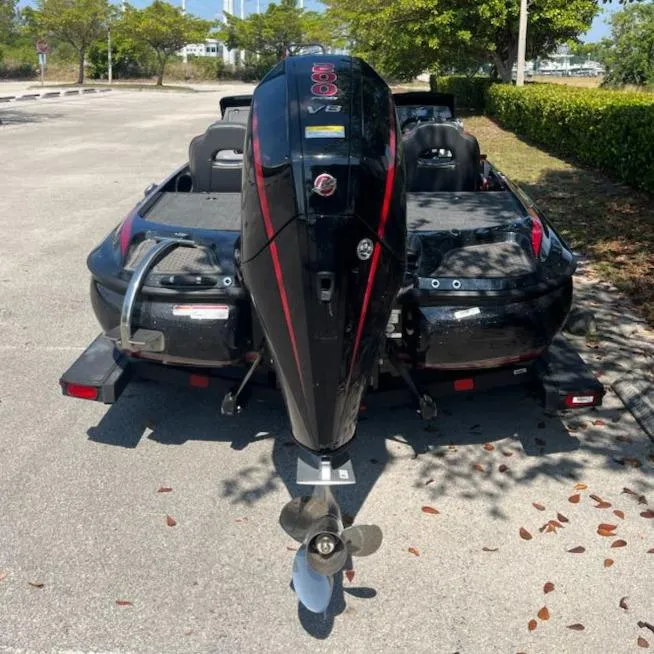 Slide: The Image of 2024 Nitro Z19 boat with powerful outboard motor in a parking lot. - 5