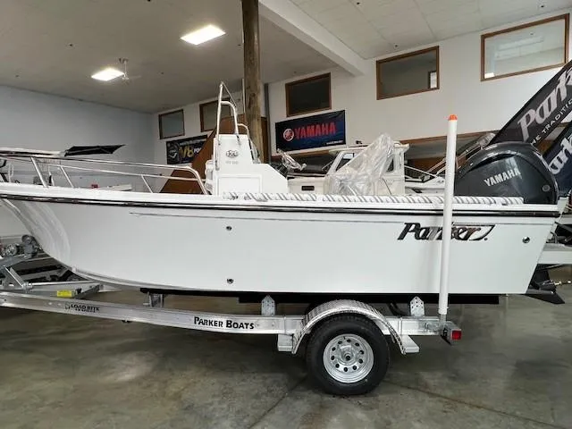 The Image of 2024 Parker 18SE Center Console boat on trailer in showroom. - 0