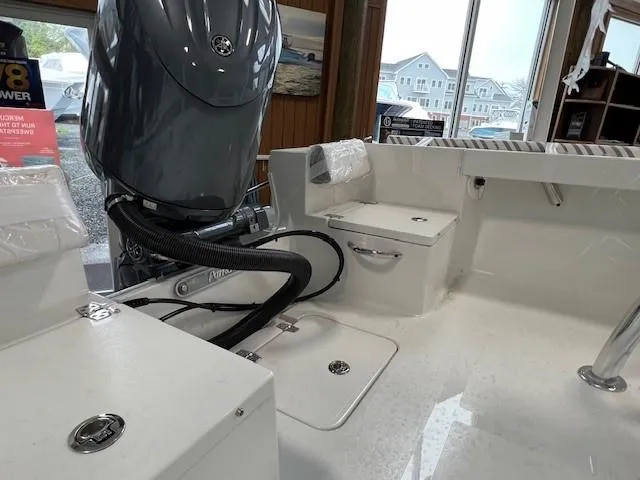 Slide: The Image of 2024 Parker 18SE Center Console boat interior with engine and storage compartments. - 3