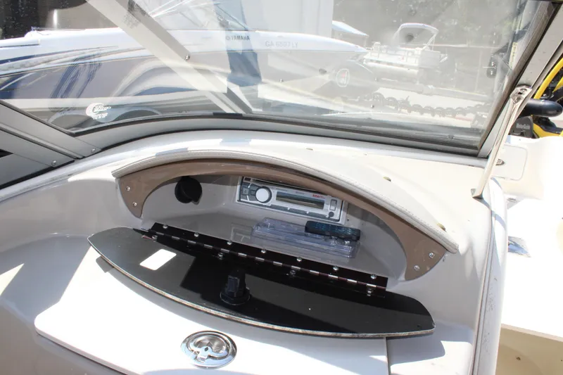 Slide: The Image of Dashboard of a 2014 Stingray 198 LF boat with stereo system. - 23