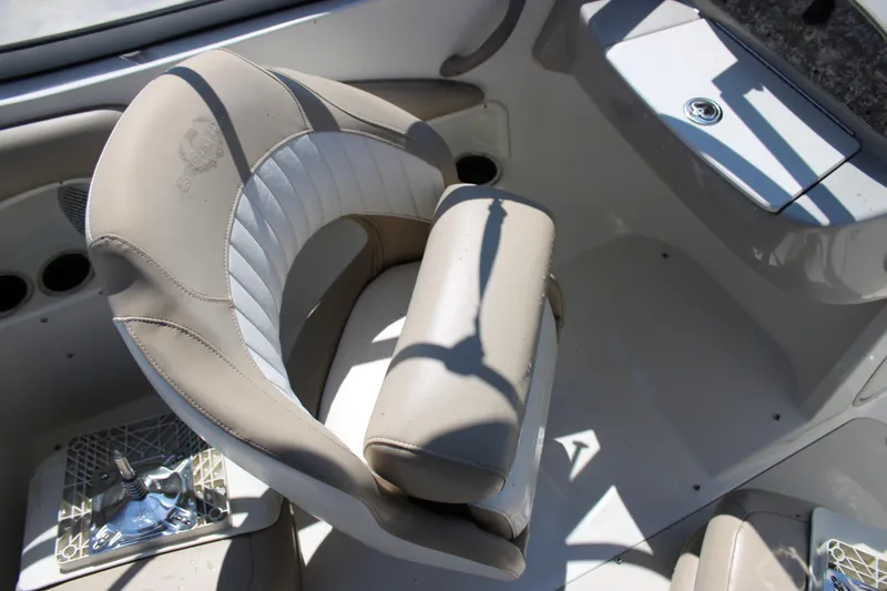 Slide: The Image of 2014 Stingray 198 LF boat interior with beige and white seating. - 24