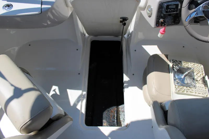 Slide: The Image of 2014 Stingray 198 LF boat interior with seating and steering wheel. - 25