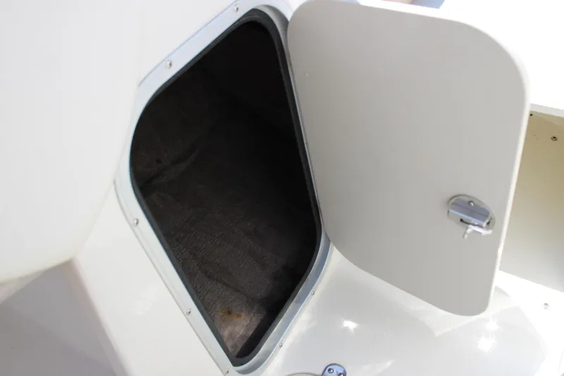 Slide: The Image of Open storage compartment on a 2014 Stingray 198 LF boat. - 26