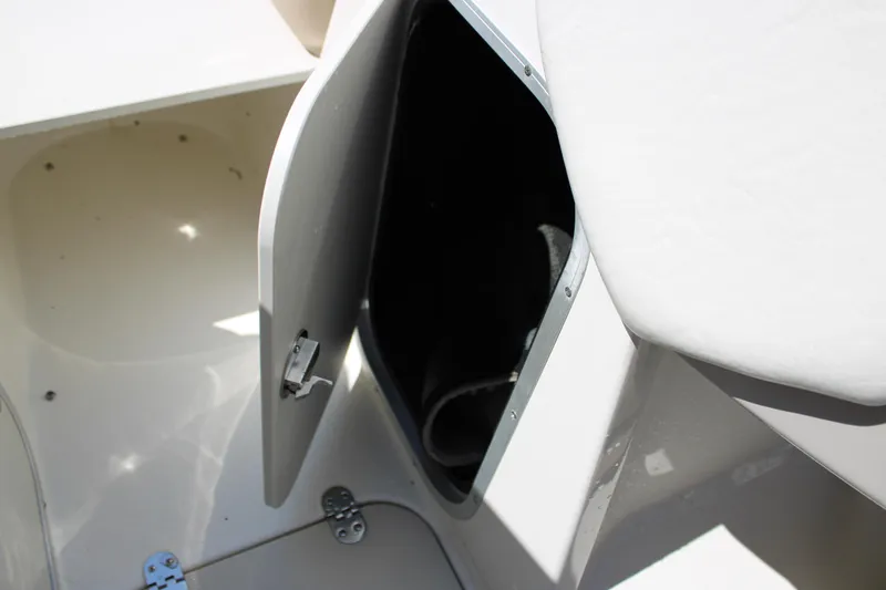 Slide: The Image of Open storage compartment on a 2014 Stingray 198 LF boat. - 27