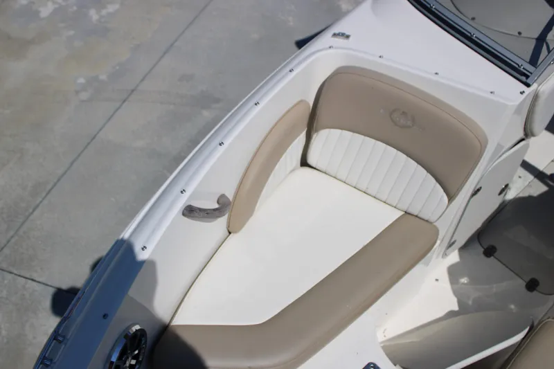 Slide: The Image of 2014 Stingray 198 LF boat interior with beige and white seating. - 32