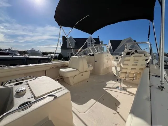 Slide: The Image of 2022 Grady-White Freedom 215 boat interior with seating and canopy. - 3