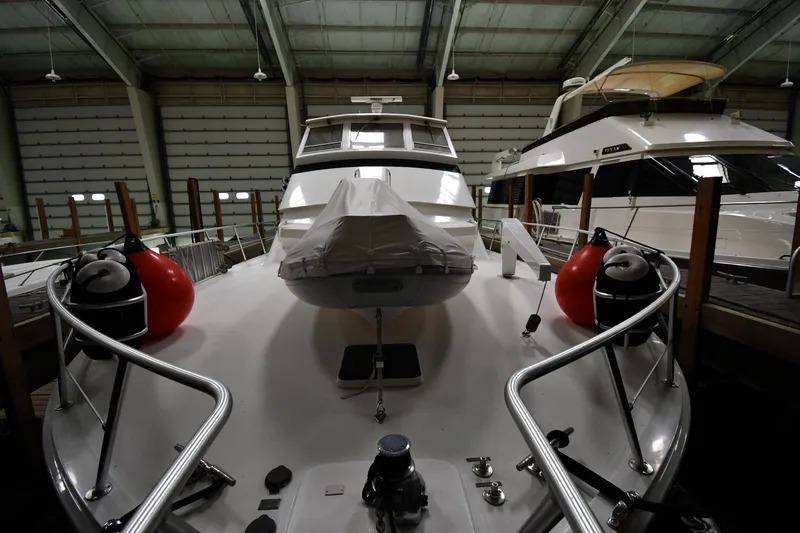 Slide: The Image of 1997 Viking 60 Cockpit Sport Yacht in indoor storage, front view. - 16