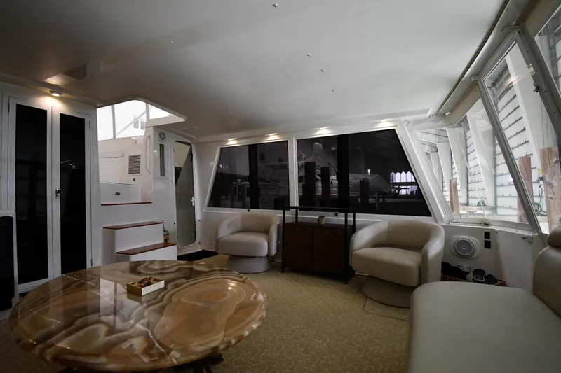 Slide: The Image of Luxurious interior of 1997 Viking 60 Cockpit Sport Yacht with modern furnishings. - 24