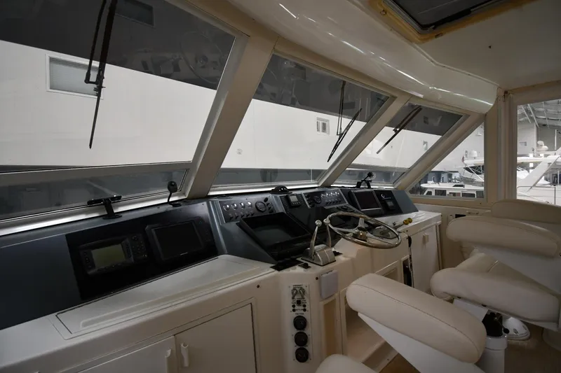Slide: The Image of Interior helm of 1997 Viking 60 Cockpit Sport Yacht with modern controls and seating. - 34