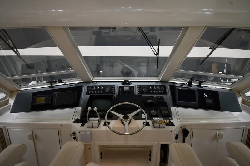 Slide: The Image of 1997 Viking 60 Cockpit Sport Yacht helm station with modern navigation equipment. - 36