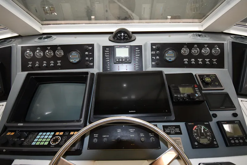 Slide: The Image of 1997 Viking 60 Cockpit Sport Yacht helm with navigation and control systems - 38