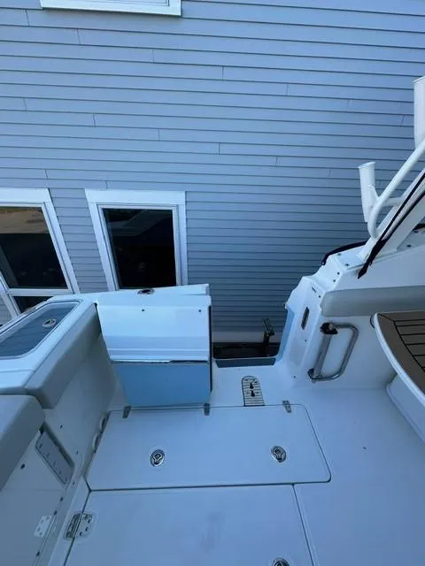 Slide: The Image of 2023 Boston Whaler 280 Vantage boat deck with storage compartments. - 11