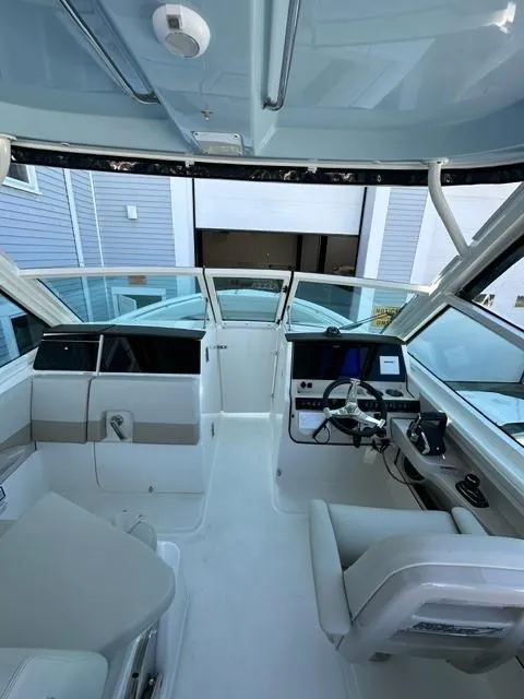 Slide: The Image of 2023 Boston Whaler 280 Vantage boat interior with modern helm and seating. - 28