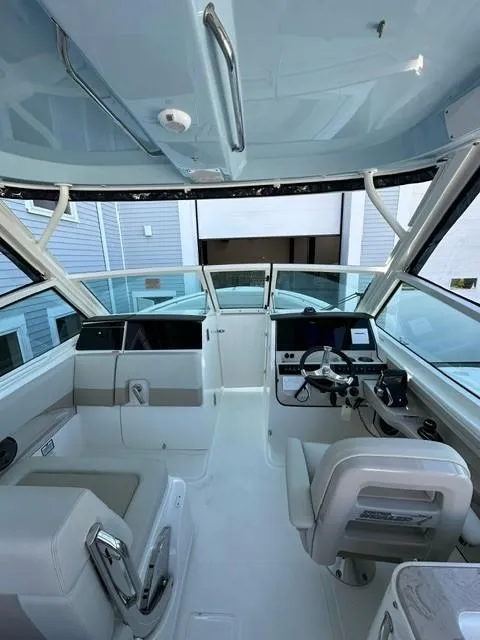 Slide: The Image of 2023 Boston Whaler 280 Vantage boat interior with helm and seating. - 30