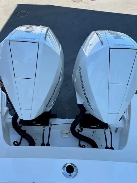 Slide: The Image of Twin Mercury outboard engines on a 2023 Boston Whaler 280 Vantage boat. - 32