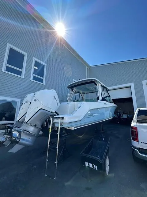 Slide: The Image of 2023 Boston Whaler 280 Vantage boat on trailer outside a building. - 36