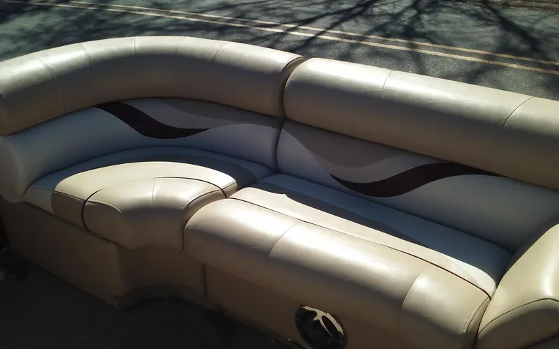 Slide: The Image of Crest Classic 210 2012 boat seating with beige and brown upholstery. - 11
