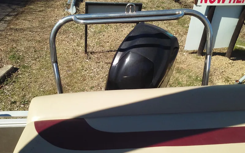 Slide: The Image of 2012 Crest Classic 210 boat rear view with motor and railing. - 15