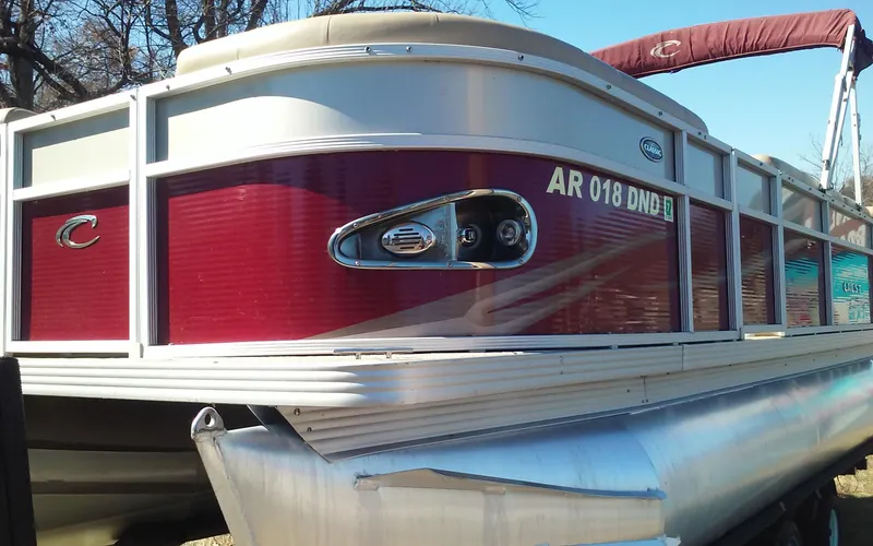 Slide: The Image of 2012 Crest Classic 210 pontoon boat with red and white exterior. - 3