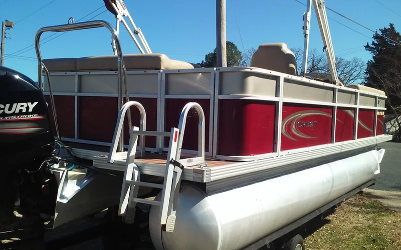 Slide: The Image of 2012 Crest Classic 210 pontoon boat with red and white exterior. - 6
