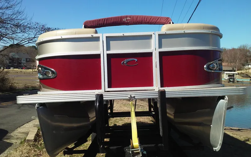 Slide: The Image of 2012 Crest Classic 210 pontoon boat with red and silver exterior. - 7