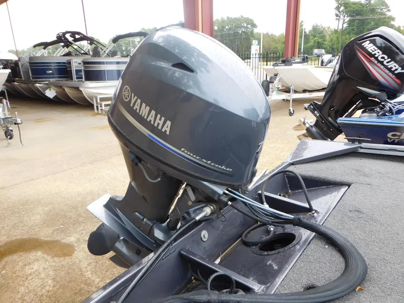Slide: The Image of 2018 Polar Kraft 175TX Pro with Yamaha outboard motor, parked in a marina. - 11