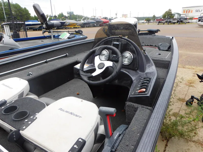 Slide: The Image of 2018 Polar Kraft 175TX Pro boat interior with steering wheel and dashboard. - 4