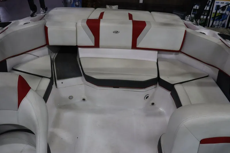 Slide: The Image of 2017 Regal 2000 ESX Bowrider interior seating area with white and red upholstery. - 10