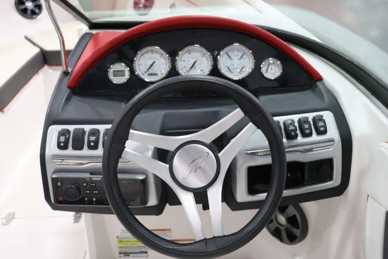 Slide: The Image of 2017 Regal 2000 ESX Bowrider dashboard with steering wheel and instrument panel. - 7