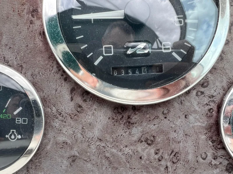 Slide: The Image of Close-up of 1997 Sea Ray 330 Sundancer boat dashboard gauges. - 14