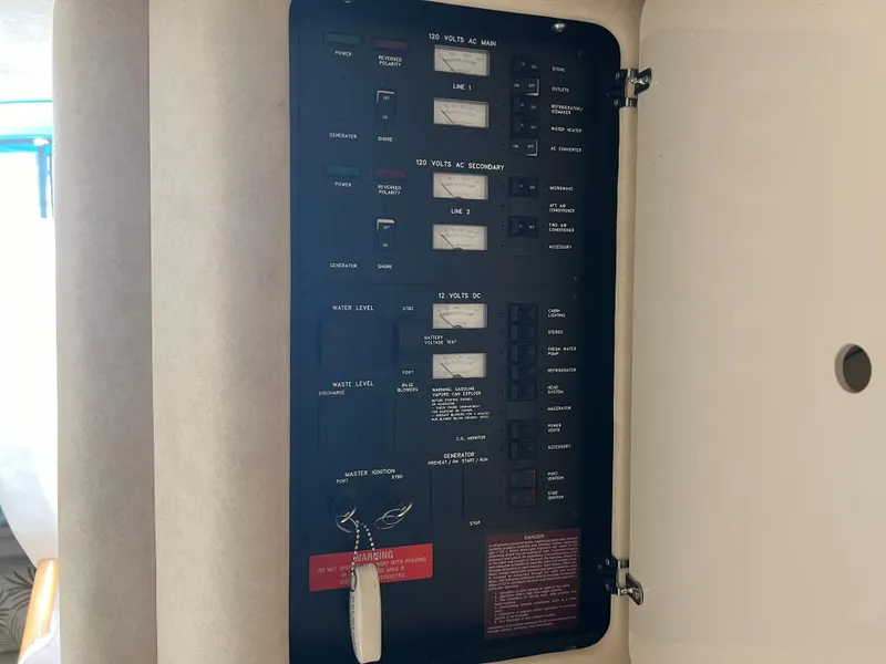 Slide: The Image of Electrical control panel on a 1997 Sea Ray 330 Sundancer boat. - 16