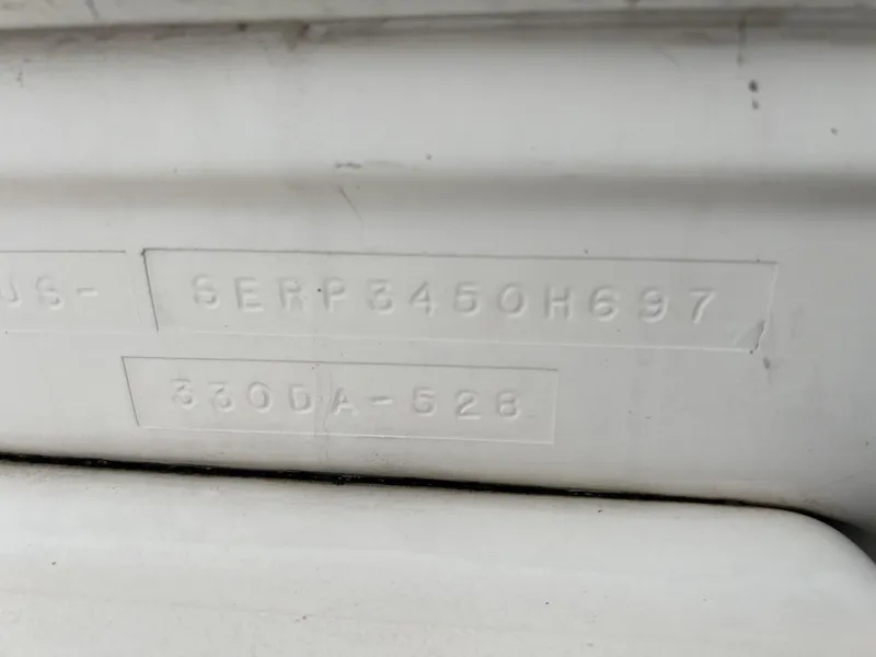 Slide: The Image of 1997 Sea Ray 330 Sundancer hull identification number (HIN) and model number. - 18