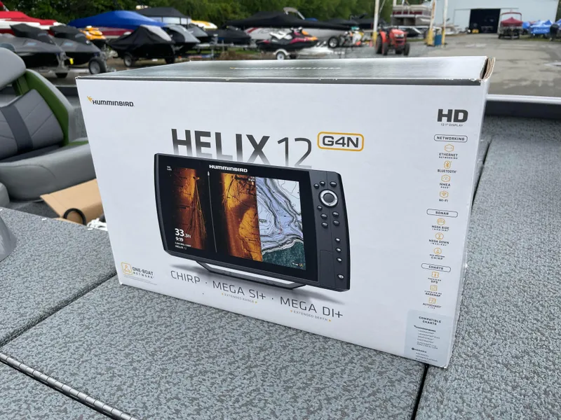 Slide: The Image of Box of Humminbird Helix 12 G4N fish finder on a 2024 G3 Sportsman 1810 PFX boat. - 12