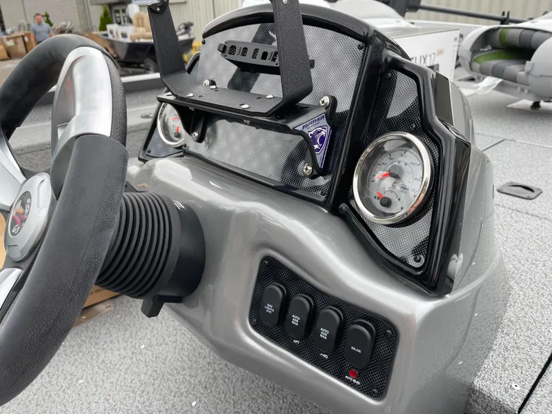 Slide: The Image of 2024 G3 Sportsman 1810 PFX boat dashboard with steering wheel and control panel. - 6