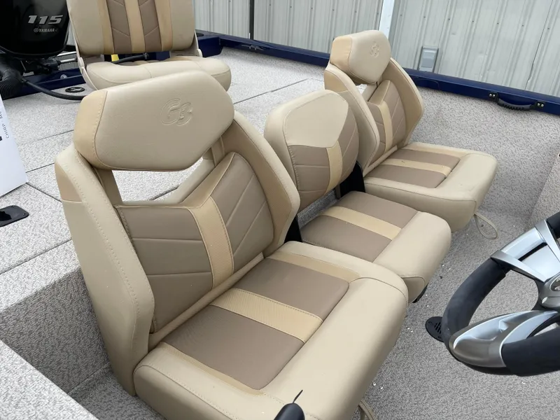 Slide: The Image of 2024 G3 Sportsman 1810 PFX boat with beige and brown cushioned seats. - 5
