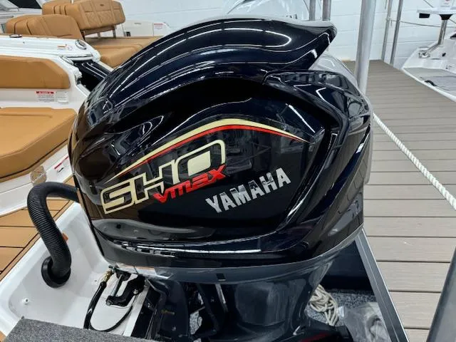 Slide: The Image of Yamaha SHO VMAX engine on 2025 Chaparral 250 OSX boat, docked with tan seating. - 28