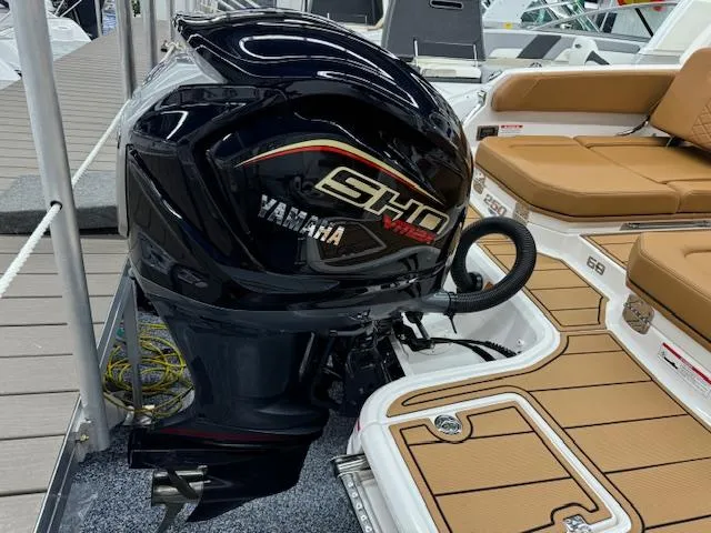 Slide: The Image of 2025 Chaparral 250 OSX boat with Yamaha VMAX SHO outboard engine, featuring tan seating. - 30