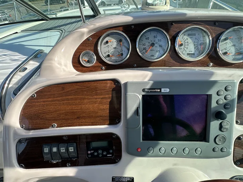 Slide: The Image of 2007 Chaparral 310 Signature boat dashboard with gauges and navigation system. - 14