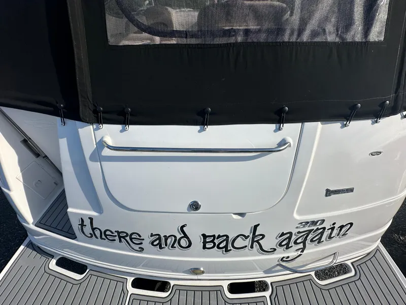 Slide: The Image of 2007 Chaparral 310 Signature boat with There and Back Again text on the stern. - 3