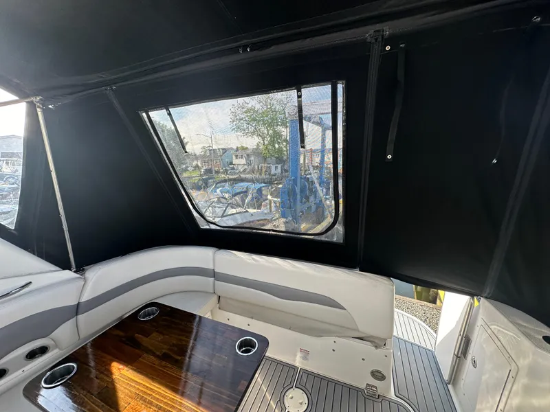 Slide: The Image of Interior of 2007 Chaparral 310 Signature boat with seating and table. - 7