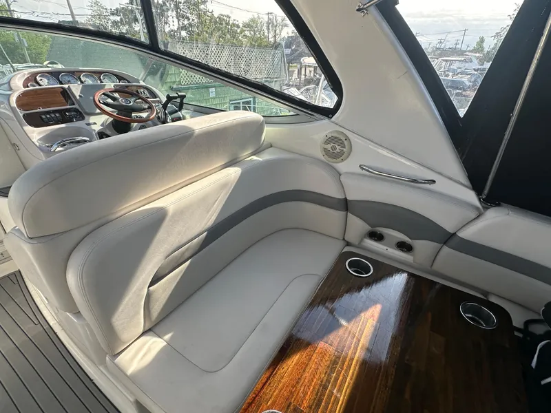 Slide: The Image of Interior of 2007 Chaparral 310 Signature boat with white and gray seating. - 9