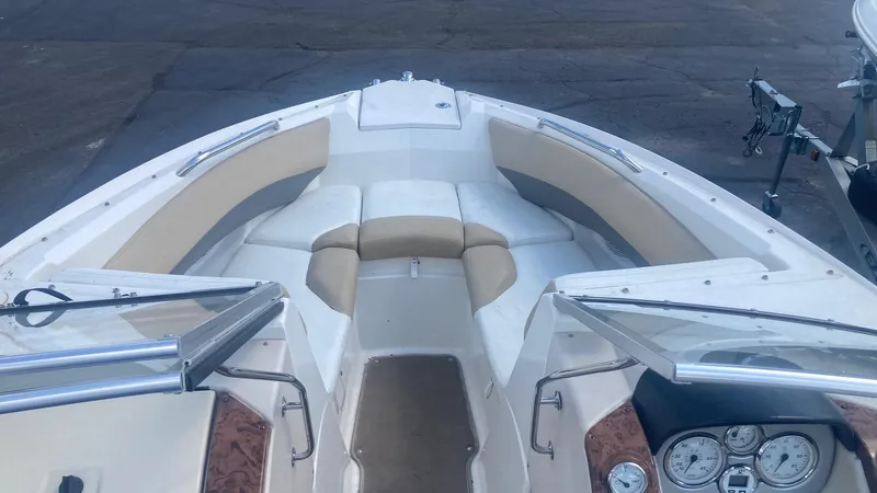 Slide: The Image of 2005 Larson 208LXi boat interior with beige and white seating. - 5